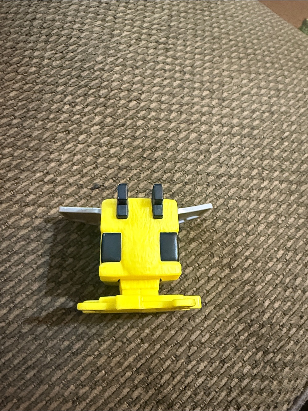 Bee figure (#10) from the 2025 McDonald's Minecraft Movie Happy Meal collection.